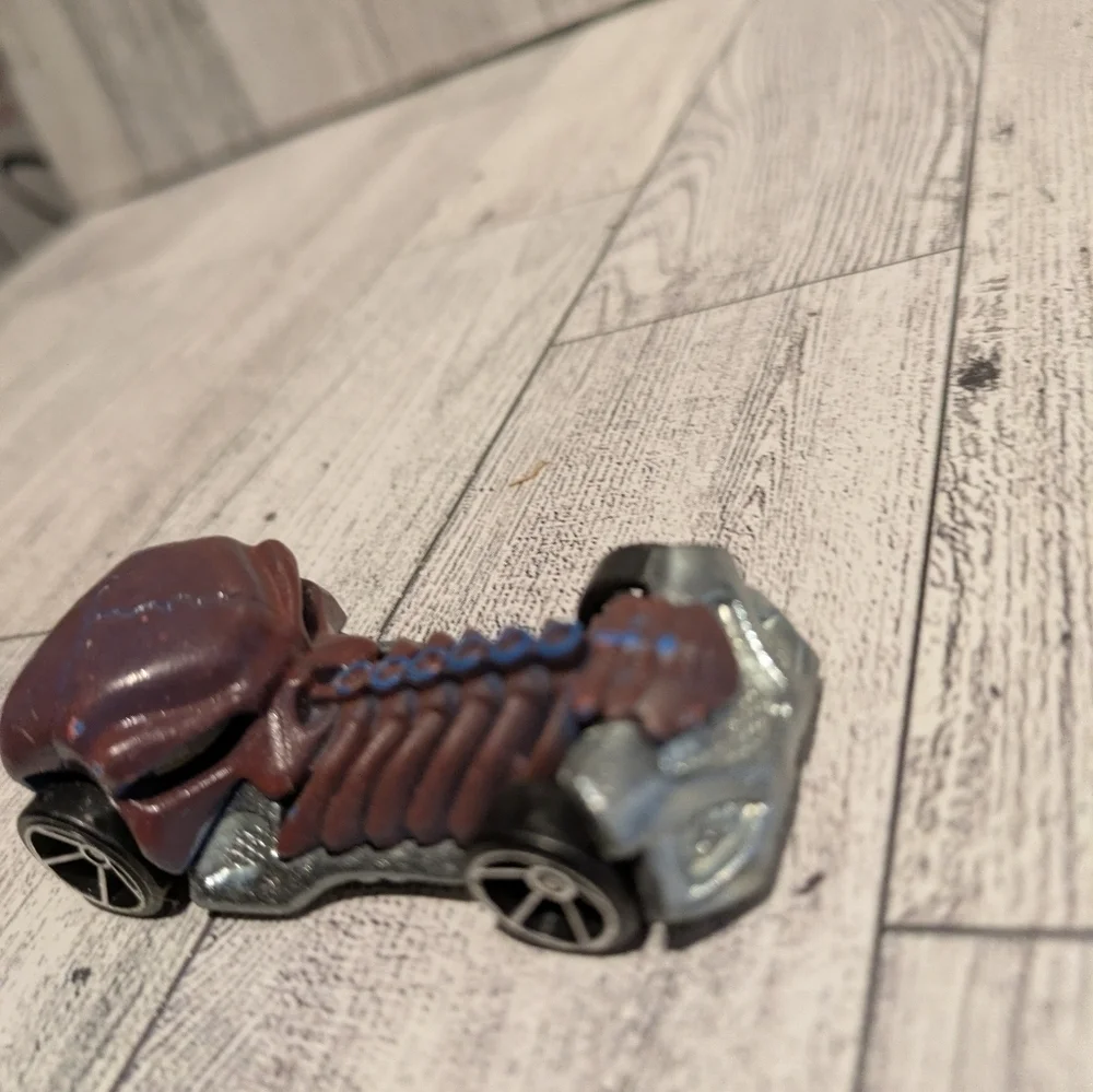 hot Wheels Bone Racer Toy Car with Brown and Silver Accents